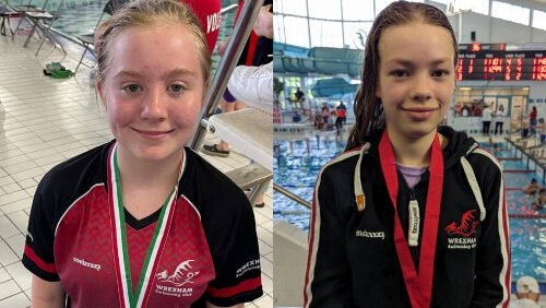 A photo showing two of our students with medals from Wrexham Swimming Club