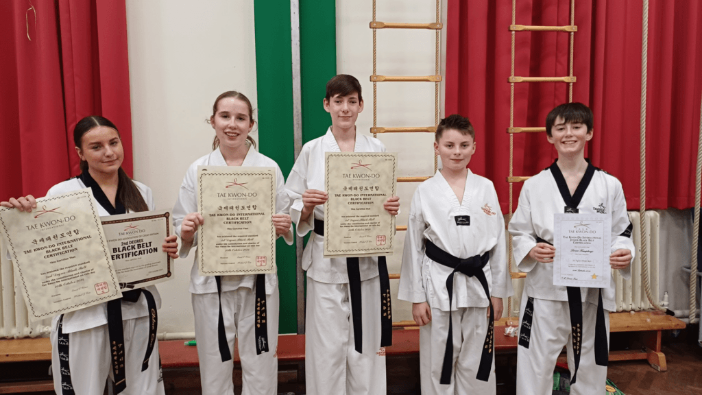 A photo of students who have passed the 1st Dan black belts at Hope/Wrexham Taekwondo circa October 2024