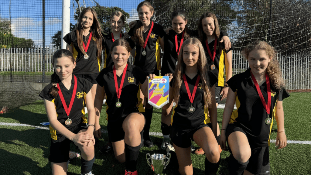 A photo of our Year 8 girls' football team after winning the Utilita Football Girls competition with Wrexham AFC circa October 2024