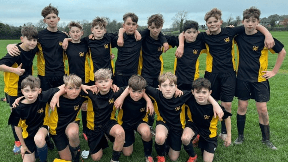 A photo of the Year 8 Football Team after playing Connahs Quay, circa November 2024