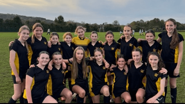 A photograph of our U13 Girls' Football team after a victory over Rhosnesni High, circa November 2024