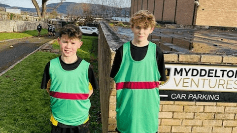 A photograph of two students who took part of the North East Wales Cross Country Championships, circa November 2024