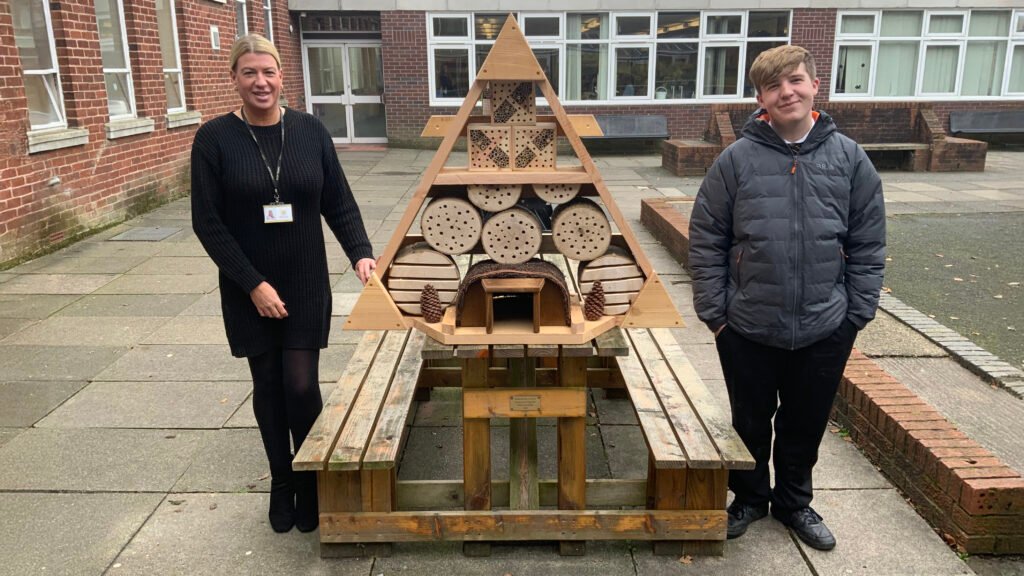 A photograph of students working on the School Garden Project in the Quad, circa November 2024