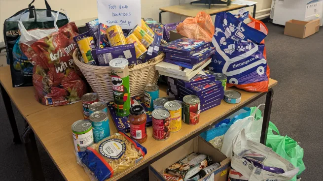 A photograph of the donations to the Sixth Form Food Bank Charity Event, circa December 2024.