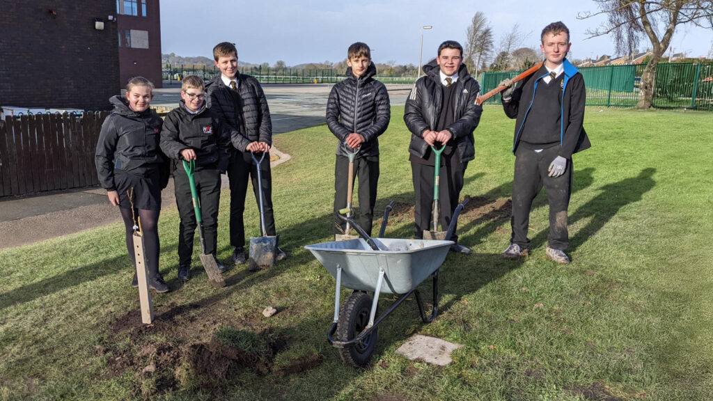 Social media image of Year 10 students planting new fruit trees on campus (27/01/25)