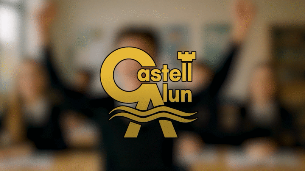 Poster frame image for video featuring the Castell Alun Logo with a blurred version of our Student Success reel behind it