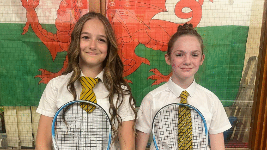 A photograph of two students who were the LTA Road to Wimbledon girls' winner and runner up respectively, circa June 2025