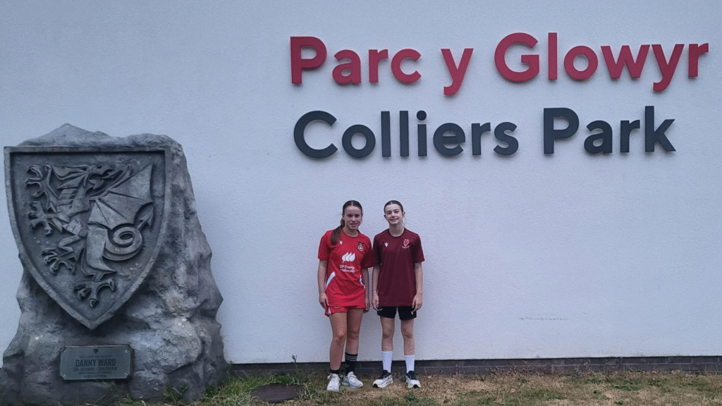 A photograph of two students who have achieved great success by trialling for the FAW North Wales U14 Girls Academy, circa June 2025