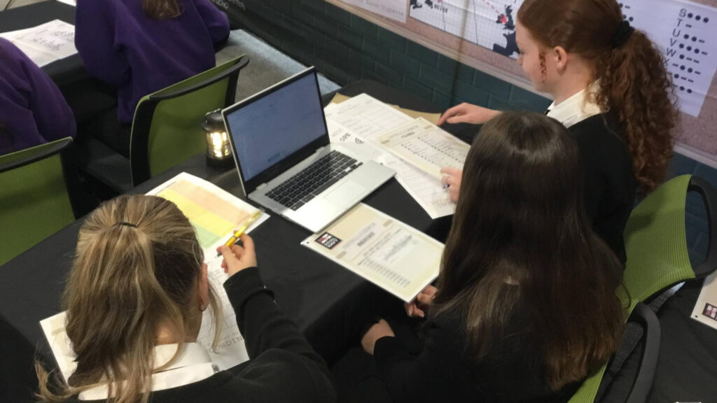 A photograph of students during the Empower Cyber First Girls event at Coleg Cambria, circa July 2025