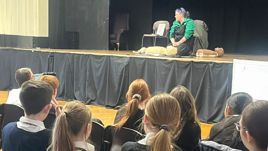 A photograph of students watching one of the Crucial Crew PSHE sessions, circa November 2025