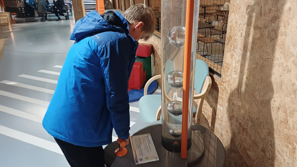 A photograph of a student at the Xplore Science Discovery Centre in Wrexham, circa November 2025