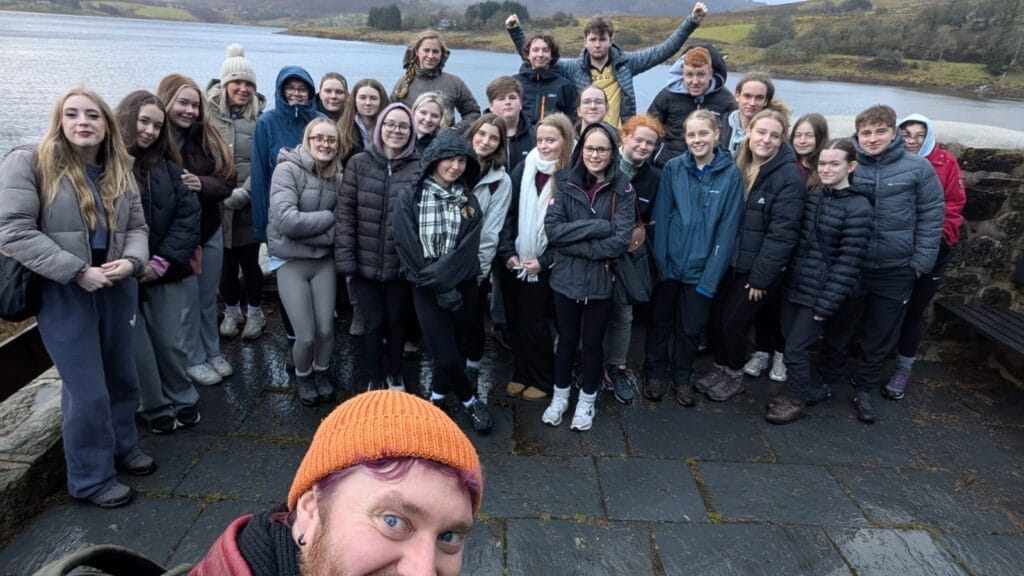 A-level Cymraeg students standing together outdoors during their residential visit to Gwersyll yr Urdd, Glan Llyn, circa January 2026