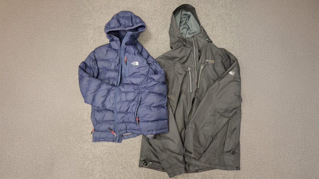 Two unclaimed coats laid out as part of the school’s lost property system, including a blue The North Face jacket, circa February 2026