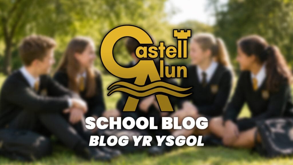 Promotional School Blog graphic showing a blurred outdoor scene of four students in Castell Alun uniform sitting together on grass, with the Castell Alun logo overlaid above the text “School Blog” and “Blog yr Ysgol”.