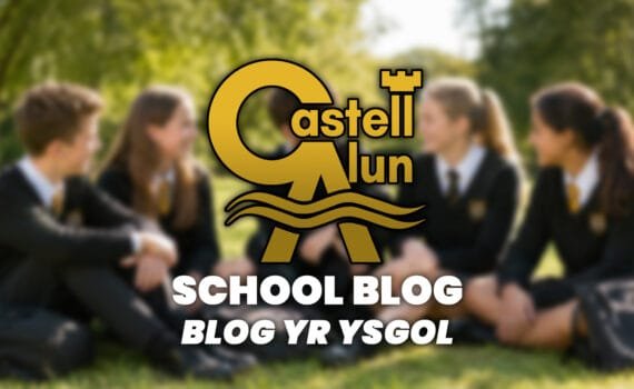 Promotional School Blog graphic showing a blurred outdoor scene of four students in Castell Alun uniform sitting together on grass, with the Castell Alun logo overlaid above the text “School Blog” and “Blog yr Ysgol”.