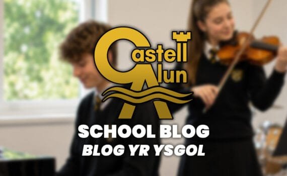Promotional School Blog graphic showing a blurred music classroom scene with one student playing keyboard and another playing violin, overlaid with the Castell Alun logo and the text “School Blog” and “Blog yr Ysgol”.