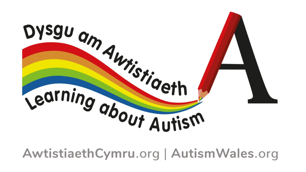 Autism Wales promotional graphic featuring a rainbow ribbon flowing from a large red pencil forming the letter “A.” The image includes bilingual text reading “Dysgu am Awtistiaeth / Learning about Autism” and the website addresses “AwtistiaethCymru.org” and “AutismWales.org” on a light grey background.