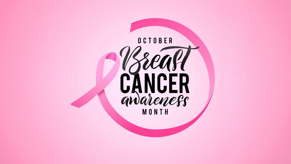 Breast Cancer Awareness Month graphic featuring a pink awareness ribbon and the text “October Breast Cancer Awareness Month” on a pink background.